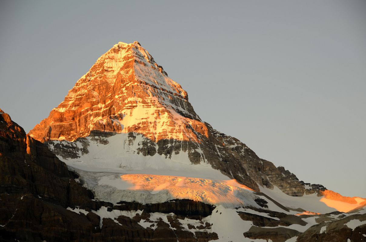 23 Bright Orange Light Of Sunrise On Mount Assiniboine And Glacier Below Summit From Lake Magog